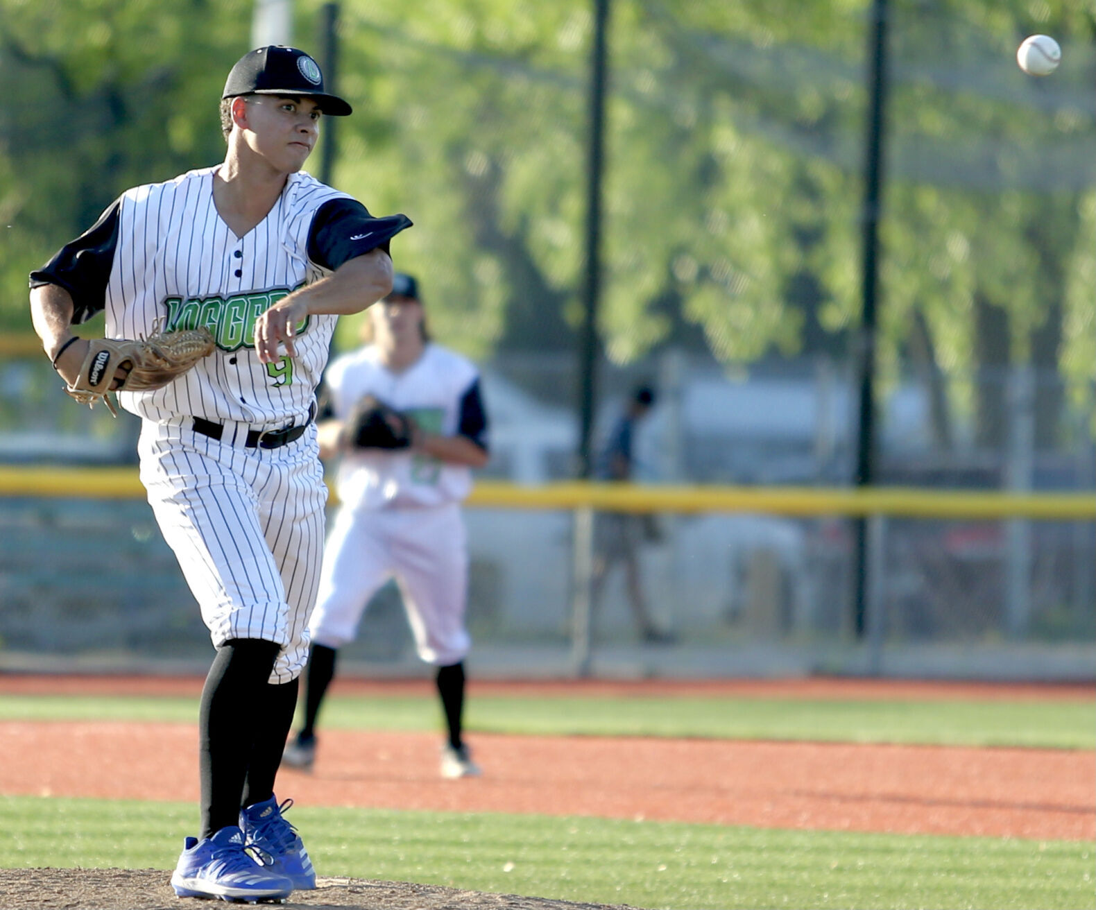 Chase Chatman throws to first